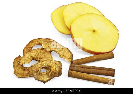 Apple slices, three cinnamon sticks, apple chips isolated on a white background Stock Photo