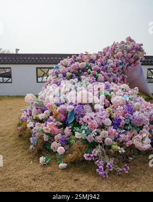 Colourful flowers on the ground in Zhujiajiao Old Town, China. Stock Photo