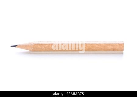 Wooden pencil lying on a clean surface with pointed tip ready for writing or drawing tasks Stock Photo