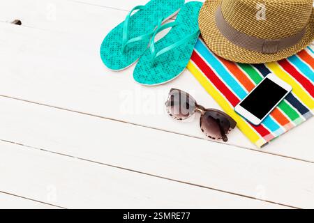 Bright summer leisure items on a beachside wooden surface create a relaxing holiday vibe Stock Photo