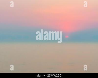 Defocused sunset over the sea Stock Photo