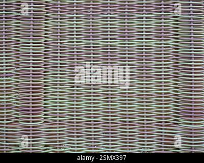 The synthetic rattan weave of a beach chair offers a decorative texture, is weatherproof but ecologically controversial – perfect as a texture or back Stock Photo