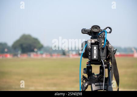 Professional Video camera on tripod to record a event Stock Photo