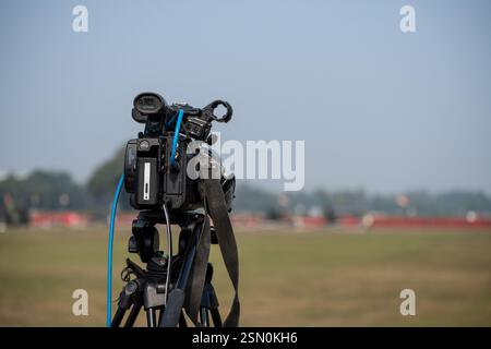 Professional Video camera on tripod to record a event Stock Photo