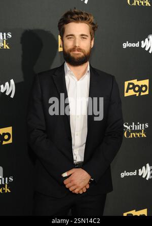 Dustin Milligan arriving at the premiere of Pop TV's 'Schitt's Creek