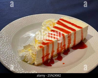 Cheese cake with strawberry syrup. Stock Photo