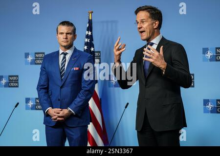 (250213) -- BRUSSELS, Feb. 13, 2025 (Xinhua) -- U.S. Secretary of Defense Pete Hegseth (L) and NATO Secretary General Mark Rutte jointly attend a press conference in Brussels, Belgium, Feb. 13, 2025. U.S. Secretary of Defense Pete Hegseth on Wednesday ruled out Ukraine's accession to the North Atlantic Treaty Organization (NATO) as part of a negotiated settlement to end the Ukraine-Russia conflict. Delivering opening remarks at the Ukraine Defense Contact Group meeting in the NATO headquarters in Brussels, Belgium, Hegseth said it is Washington's stance that security guarantees for Ukraine " Stock Photo