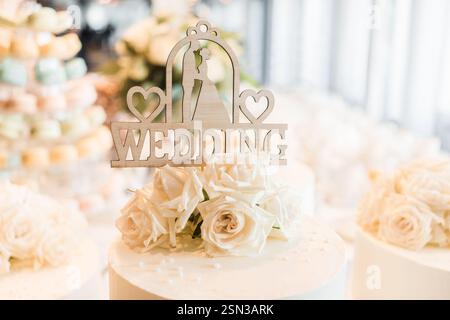 wedding cake decoration in restaurant - selective focus point on wedding cake. Wedding candy bar. Stock Photo