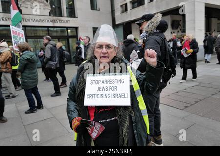 London, UK. 13th Feb, 2025. Supporters of Stop the War and the Socialist Workers Party gather outside Westminster Magistrates' Court to demand the charges against Chris Nineham be dropped. Nineham, vice-chair of Stop the War, was the chief steward of the demo and one of 77 arrests made by police at the Palestine march in London. Protesters argue the charges are politically motivated and part of a broader crackdown on dissent, calling for the right to protest to be upheld. Credit: Joao Daniel Pereira/Alamy Live News Stock Photo