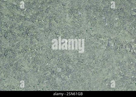 Close-up of an open concrete surface with a filler on which small stones are visible Stock Photo