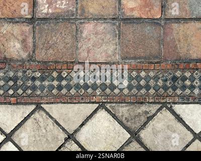Outdoor floor art with diamond mosaic accent pattern and honed outdoor stone tiles. Suitable for outdoor garden flooring. Classic vintage Mediterranea Stock Photo