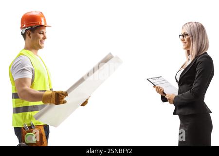 Construction worker holding a blueprint and talking to a businesswoman isolated on white background Stock Photo