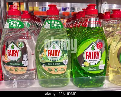 Bobruisk, Belarus - 10 February 2025: Bright bottles of dishwashing liquids FAIRY are arranged on a store shelf. Each bottle features a unique color a Stock Photo