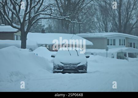 Montreal, Canada. 13th Feb, 2025. A vehicle is seen under the snow during the major winter depression brought snowstorms that dumped up to 40 centimeters of snow in Montreal. Schools were closed and flights were cancelled due to the adverse weather conditions. on February 13, 2025 in Montreal, Canada. (Photo by Horacio Zamora Rios/ Eyepix Group/Sipa USA) Credit: Sipa USA/Alamy Live News Stock Photo