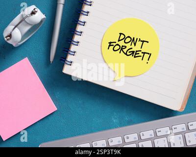 Notebook featuring a don't forget reminder, embodying the concept of time management and deadline. Stock Photo