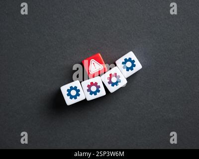 System error. Malfunction of the production process. Red dice showing error alert notification among white cubes representing settings gears. Stock Photo
