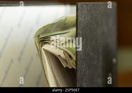 Old dusty stack of papers, files, documents on the shelves of archive room Stock Photo