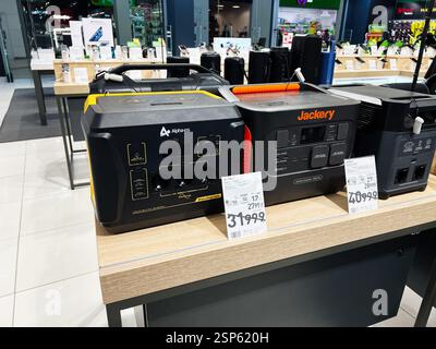 Lviv, Ukraine - February 13, 2025: Various portable power generators arranged on a display table in a retail store Stock Photo