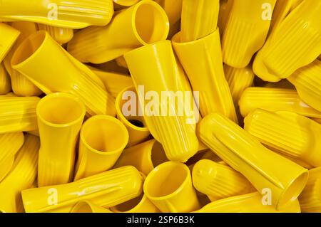 Electrical yellow wire connectors wing nuts plastic computer components. Stock Photo