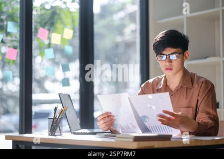 Businessman or student studying online, analyzing financial reports Stock Photo