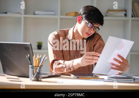 Businessman or student studying online, analyzing financial reports Stock Photo