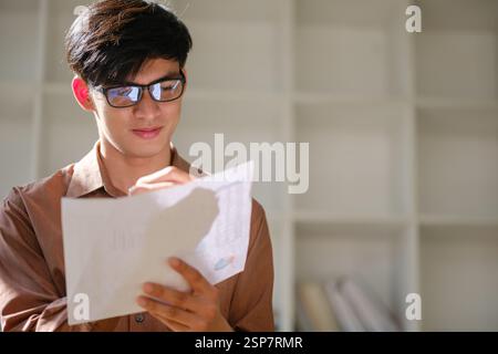 Young businessman analyzing financial data a Stock Photo