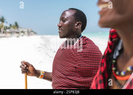Ethnic masai males looking far away. Stock Photo