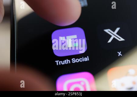 Truth Social app logo on a smartphone screen. February 25, 2025. High quality photo Stock Photo