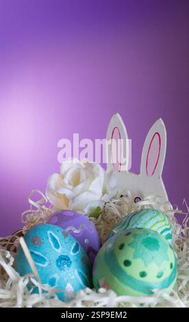 Easter eggs , flowers and funny bunny to celebrate Easter. Wallpaper for Easter announcements and cards.Vertical real picture, ideal for social media Stock Photo
