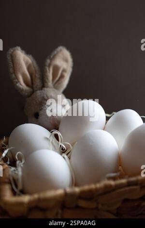 Basket with eggs as a celebration of new life and resurrection. Traditional religious day of Easter . Life and resurrection symbolized by the egg. Ver Stock Photo