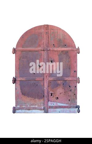 Aged double iron doors with arched top, reddish rusted surface, dents, and three hinges on each side, evoking Ottoman-era craftsmanship, once part of Stock Photo
