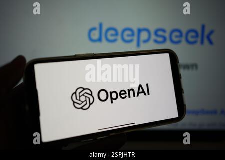 Roosendaal, The Netherlands - February 10, 2025: A mobile phone displaying the logo of OpenAI, with the website of deepseek in the background. Stock Photo