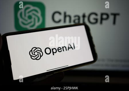 Roosendaal, The Netherlands - February 10, 2025: A mobile phone displaying the logo of OpenAI, with the logo of ChatGPT in the background. Stock Photo