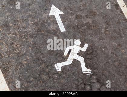 Shot of the paint marking on the asphalt indicating roller skating path Stock Photo