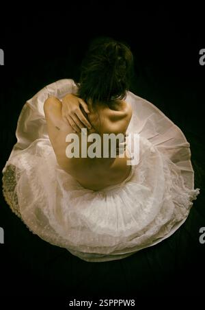 woman in organza skirt sitting on the floor 3, spain Stock Photo