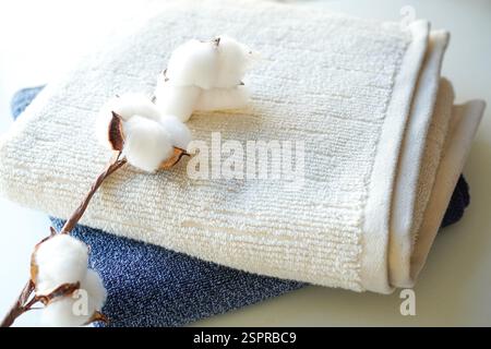 A stack of fluffy towels on white background Stock Photo
