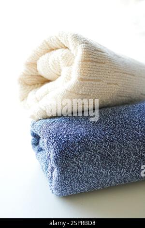 A stack of fluffy towels on white background Stock Photo