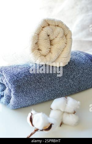 A stack of fluffy towels on white background Stock Photo