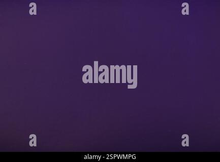 Uniform dark blue background throughout the frame. Stock Photo