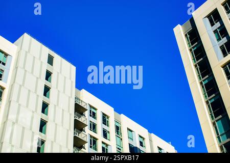 Low angle view of a low-rise residential building with reflective ...