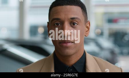 Close up portrait serious 30s man African American successful businessman headshot ethnic guy confident looking at camera male car owner client Stock Photo