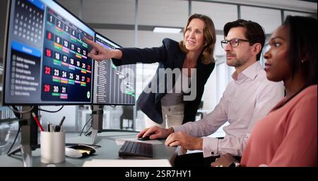 Busy Office Workers Utilizing Kanban Task Board for Scheduling Tasks. Stock Photo