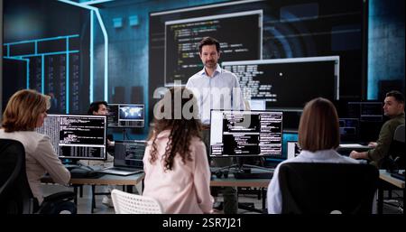 Black web developers coding software in office presentation meeting. Stock Photo