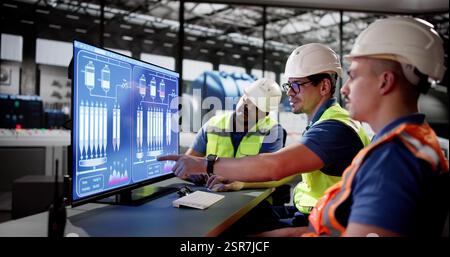 Electricity Generation Engineer Operating Turbine in Diverse Power Plant. Stock Photo