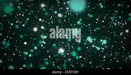 Image of green and white spots moving on black background Stock Photo