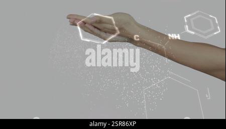 Hand holding molecular structures, image of chemical bonds and elements Stock Photo