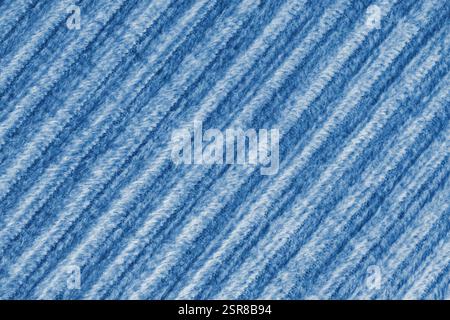 Ridge macro texture of velour corduroy blue cloth. Large ribbed, diagonal coarse weaving velveteen, striped upholstery texture fabric background, furn Stock Photo