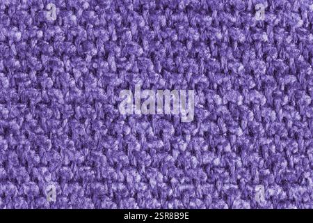 Texture of purple jacquard fabric, close up of rough weave macro. Material for home textile, upholstery and curtain decor, garment. Background, wallpa Stock Photo