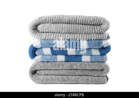 Soft fluffy striped grey and blue bath towels folded in stack isolated on white background. Terry cloth, striped pattern towel texture, cotton bath te Stock Photo