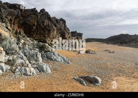 Rocks on the beach near Rhosneigr on the coast of Anglesey, North Wales. Stock Photo